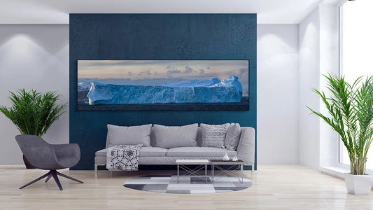 A living room with a large Antarctica fine art photography print from Artem Shestakov on the wall.