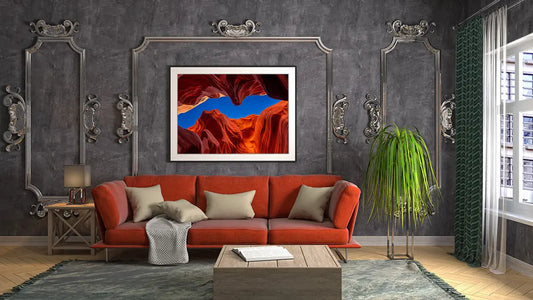 A living room with a Vibrant Shestakov Fine Art painting on the wall.