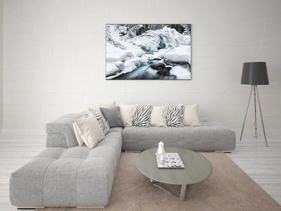 a living room with a Frozen Waterfall couch by Shestakov Fine Art and a Shestakov Fine Art coffee table.